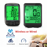 Two bicycle computer devices with green screens displaying various metrics, labeled 'Wireless or Wired'.