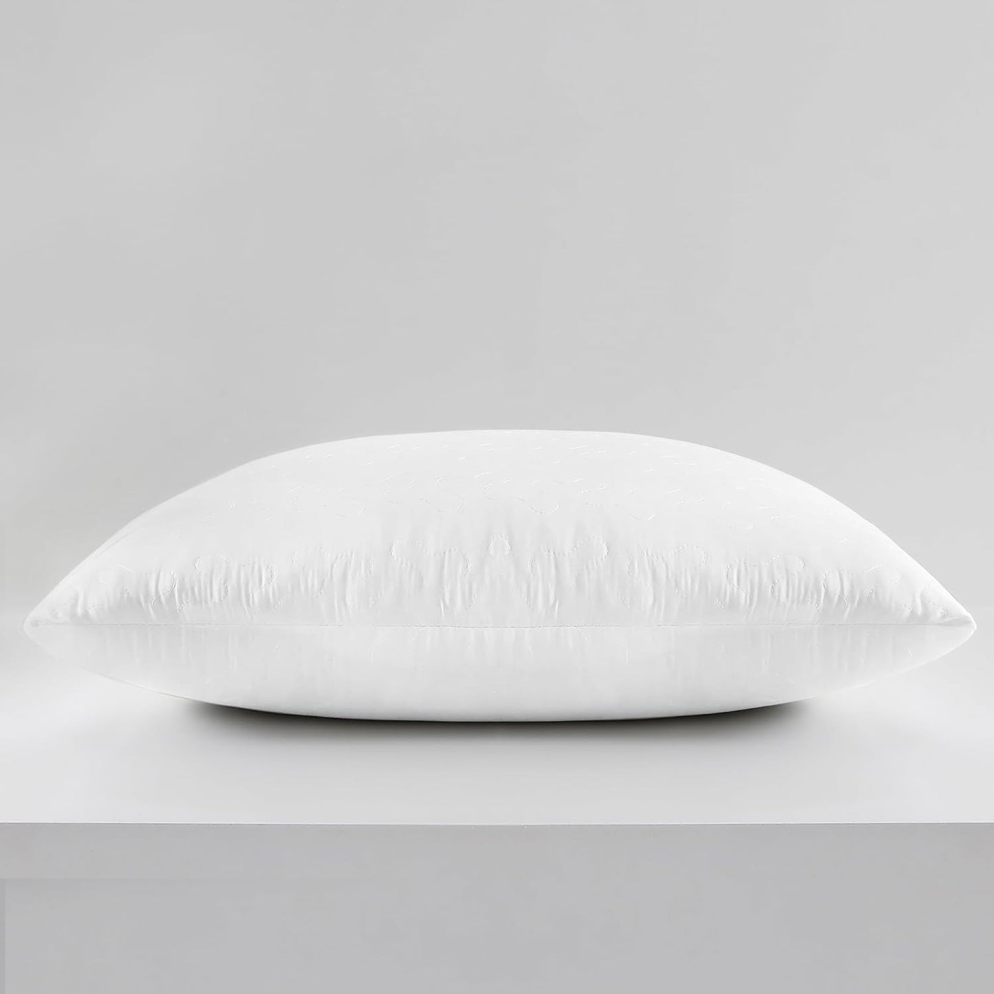 White pillow on a gray background