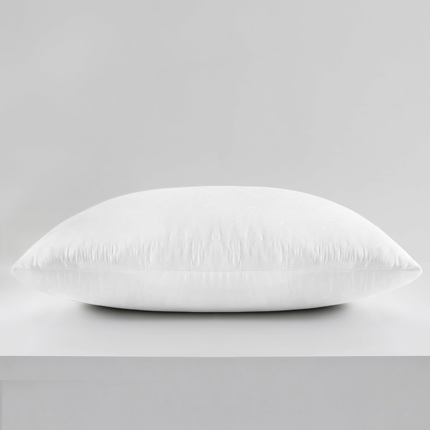 White pillow on a gray background