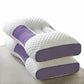 White and purple pillow on a light gray surface
